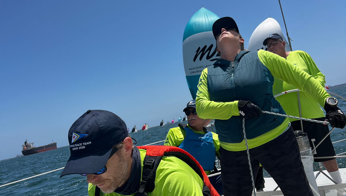 Sailors flying a spinnaker