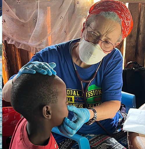 Doctor Debbie Juster goes to Africa on Missions each year to tend to the locals. She is examining a young man during her mission in 2024.