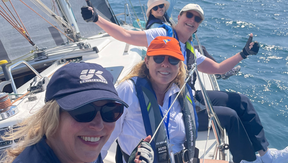 Rascal crew hiking out on the rail, underway